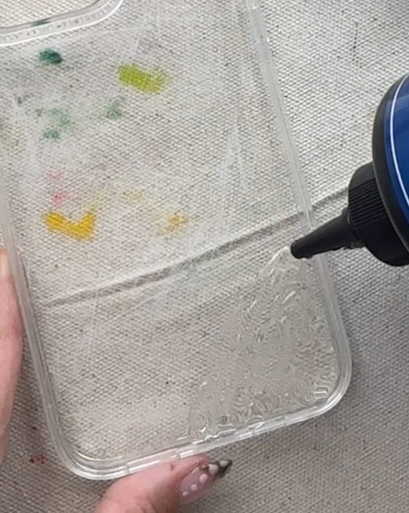 adding UV resin to phone case