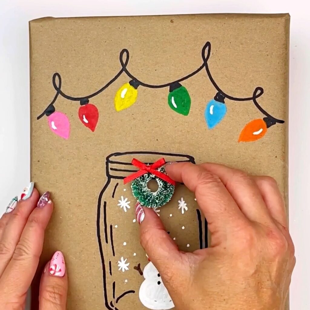 DIY Festive Wrapping Paper adding a mini wreath that is glued on