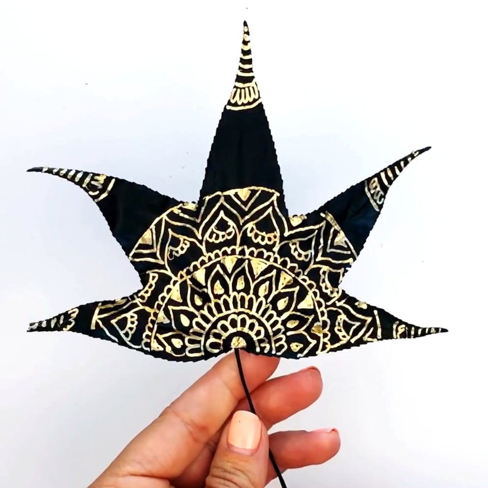 Metallic Leaf Art mandala design completed - the leaf is black and the design is in gold