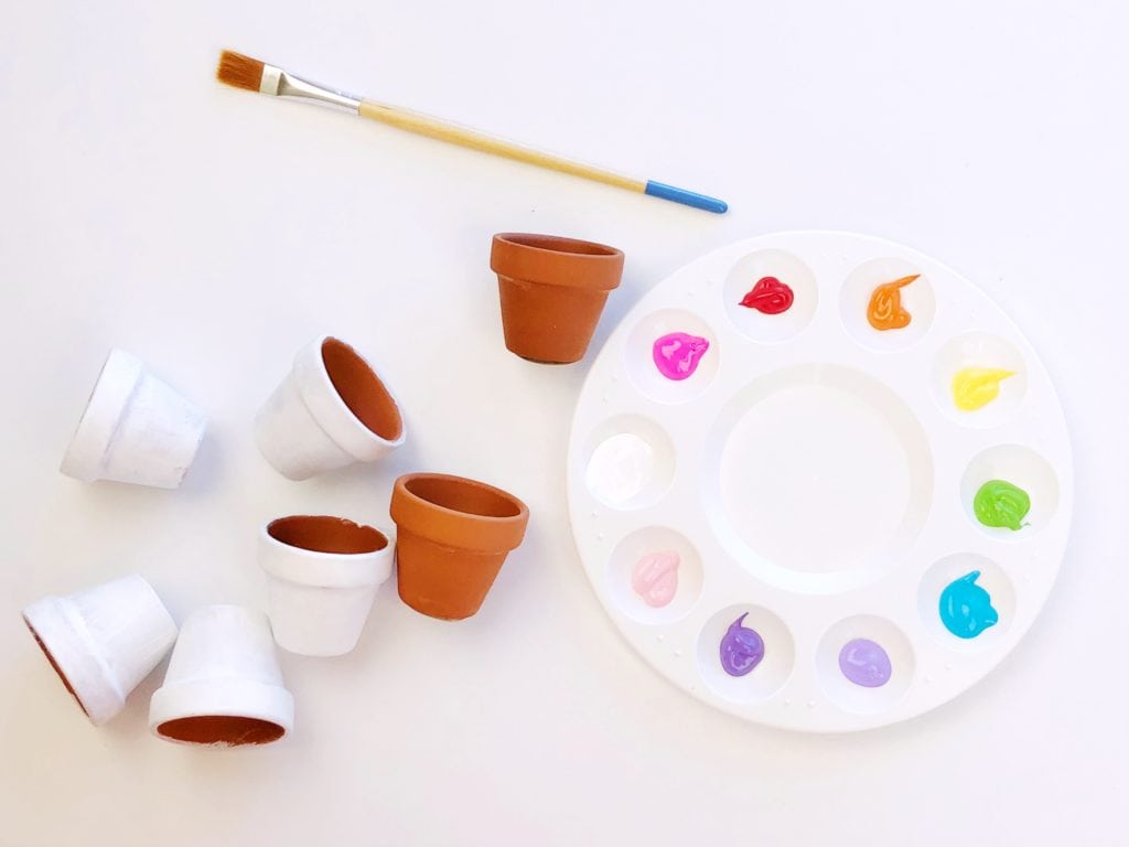 Painting mini flower parts white to prime them