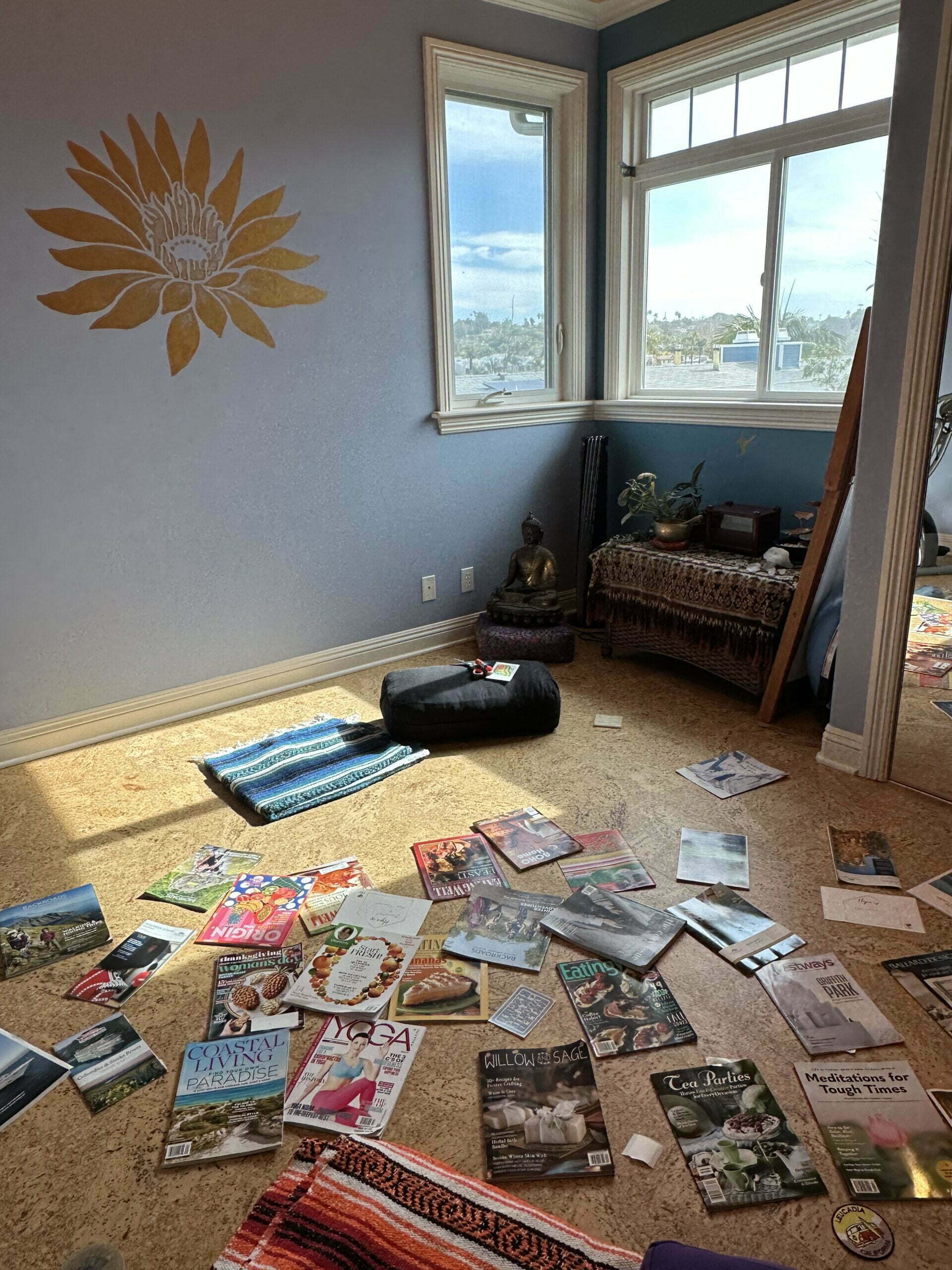 Relaxing vision board space with magazines and cushions on the floor