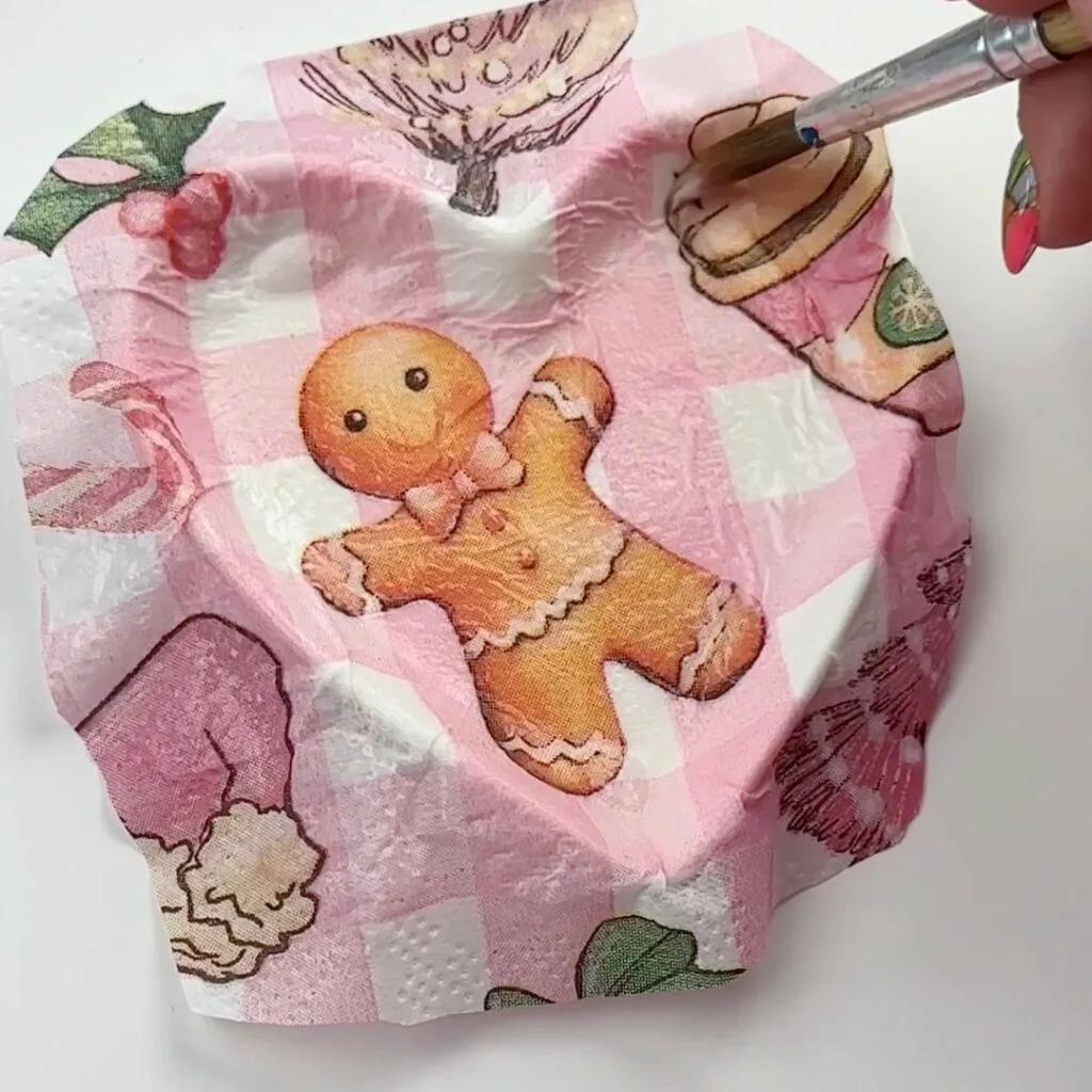 apply Mod Podge on any areas of napkin that need to be smoothed down